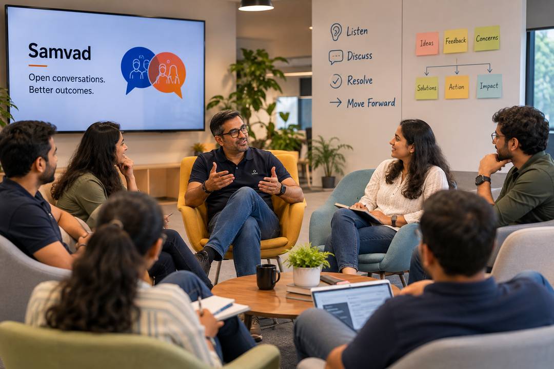 A Samvad open-conversation session in progress, with a wall listing Listen, Discuss, Resolve and Move Forward.